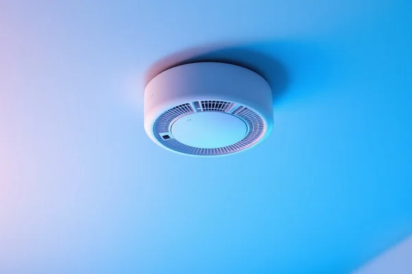 Installation of interconnected smoke alarm system in a home showing multiple alarms connected